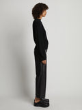 Side full length image of model wearing Bell Sleeve Cashfeel Sweater in BLACK