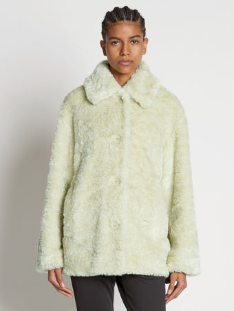 Front cropped image of model wearing Faux Rabbit Peacoat in GREEN TEA