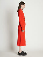 Side full length image of model wearing Rib Knit Fitted Cardigan
 in VERMILLION