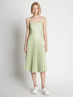 Front full length image of model wearing Drop Waist Faux Leather Dress
 in GREEN TEA