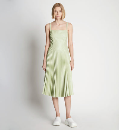 Front full length image of model wearing Drop Waist Faux Leather Dress
 in GREEN TEA