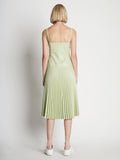 Back full length image of model wearing Drop Waist Faux Leather Dress
 in GREEN TEA