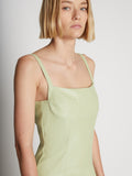 Detail image of model wearing Drop Waist Faux Leather Dress
 in GREEN TEA