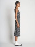 Side full length image of model wearing Speckle Knit Dress in PEARL/BLACK