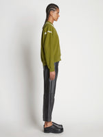 Side full length image of model wearing Tie Dye Sweatshirt
 in AVOCADO/GREEN