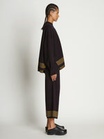 Side full length image of model wearing Cashmere Blend Sweatshirt in BLACK/DARK SAND