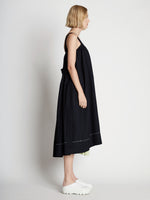 Side full length image of model wearing Drapey Suiting Belted Dress in BLACK
