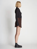 Side full length image of model wearing Satin Mini Skirt
 in MOCHA