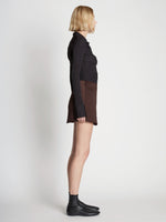 Side full length image of model wearing Satin Mini Skirt
 in MOCHA