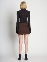 Back full length image of model wearing Satin Mini Skirt
 in MOCHA