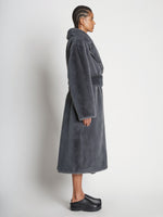 Side full length image of model wearing Faux Fur Belted Coat in DARK GREY