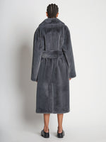 Back full length image of model wearing Faux Fur Belted Coat in DARK GREY