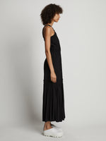 Side full length image of model wearing High Neck Dress in BLACK