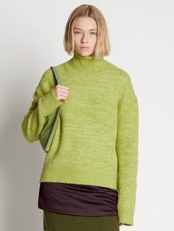 Front cropped image of model wearing Fluffy Knit Turtleneck Sweater in AVOCADO/HONEYDEW