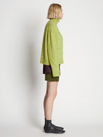 Side full length image of model wearing Fluffy Knit Turtleneck Sweater in AVOCADO/HONEYDEW