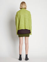 Back full length image of model wearing Fluffy Knit Turtleneck Sweater in AVOCADO/HONEYDEW