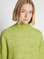 Detail image of model wearing Fluffy Knit Turtleneck Sweater in AVOCADO/HONEYDEW