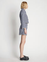 Side full length image of model wearing Tweed Mini Skirt in BLUE MULTI