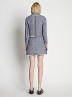 Back full length image of model wearing Tweed Mini Skirt in BLUE MULTI