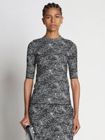 Front cropped image of model wearing Speckle Knit Sweater in PEARL/BLACK
