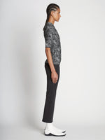 Side full length image of model wearing Speckle Knit Sweater in PEARL/BLACK