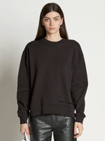 Front cropped image of model wearing Long Sleeve Sweatshirt in BLACK