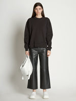 Front full length image of model wearing Long Sleeve Sweatshirt in BLACK