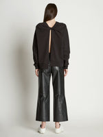 Back full length image of model wearing Long Sleeve Sweatshirt in BLACK
