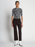 Front full length image of model wearing Scuba Cropped Flare Pants in BLACK