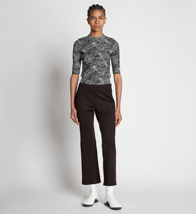 Front full length image of model wearing Scuba Cropped Flare Pants in BLACK