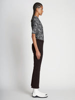 Side full length image of model wearing Scuba Cropped Flare Pants in BLACK