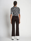 Back full length image of model wearing Scuba Cropped Flare Pants in BLACK