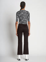 Back full length image of model wearing Scuba Cropped Flare Pants in BLACK