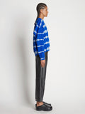 Side full length image of model wearing Tie Dye Sweatshirt in BRIGHT BLUE/PERIWINKLE