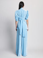 Back full length image of model wearing Silk Viscose Velvet Trousers in LIGHT BLUE