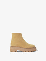 Side image of Suede Lug Sole Platform Boots in Cream