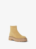 Front 3/4 image of Suede Lug Sole Platform Boots in Cream