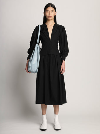 Image of model wearing Drawstring Tote in BLUE STONE