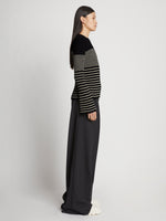 Side full length image of model wearing Boucle Mini Stripe Sweater in BLACK MULTI