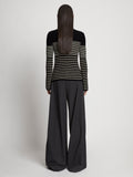 Back full length image of model wearing Boucle Mini Stripe Sweater in BLACK MULTI