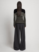 Back full length image of model wearing Boucle Mini Stripe Sweater in BLACK MULTI