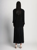 Back full length image of model wearing Sheer Pleated Flou Dress in BLACK