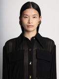Detail image of model wearing Sheer Pleated Flou Dress in BLACK