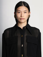Detail image of model wearing Sheer Pleated Flou Dress in BLACK