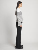 Side full length image of model wearing Boucle Mini Stripe Sweater in OFF WHITE MULTI