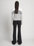 Back full length image of model wearing Boucle Mini Stripe Sweater in OFF WHITE MULTI