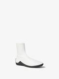 Front 3/4 image of Grip Stretch Ankle Boots in White