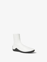 Front 3/4 image of Grip Stretch Ankle Boots in White