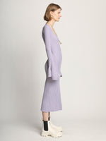 Side full length image of model wearing Fluted Rib Knit Dress in LAVENDER