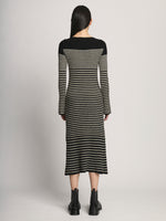 Back full length image of model wearing Boucle Mini Stripe Knit Dress in BLACK MULTI
